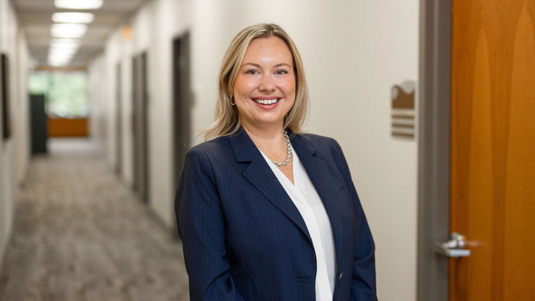 Dr. Isla Johnson smiles in a hallway at the CCNW Valley clinic. 