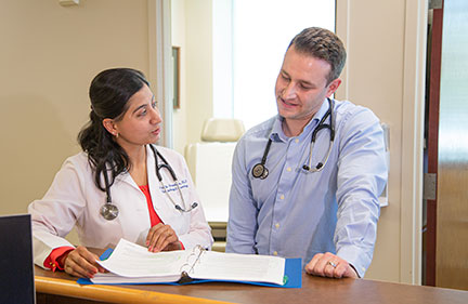 Cancer Care Northwest Medical Oncologists Dr. Srivalli Gopaluni and Dr. Swofford discuss a patient's cancer treatment options.
