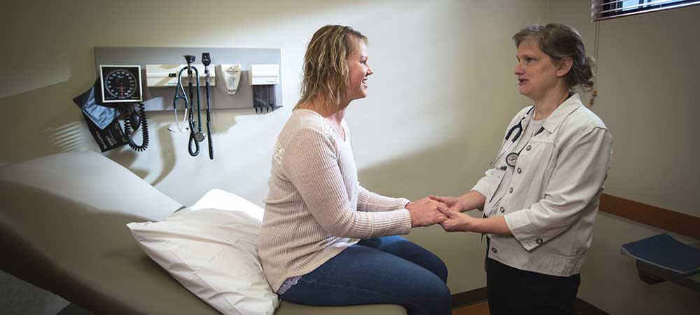 CCNW Breast Surgical Oncologist, Dr Moline, discusses surgical options with patient