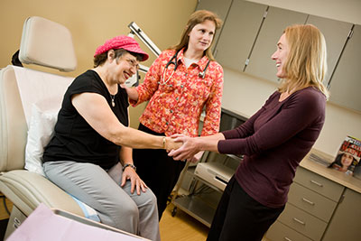 Cancer Care Northwest physicians consult with a breast cancer patient at her first appointment
